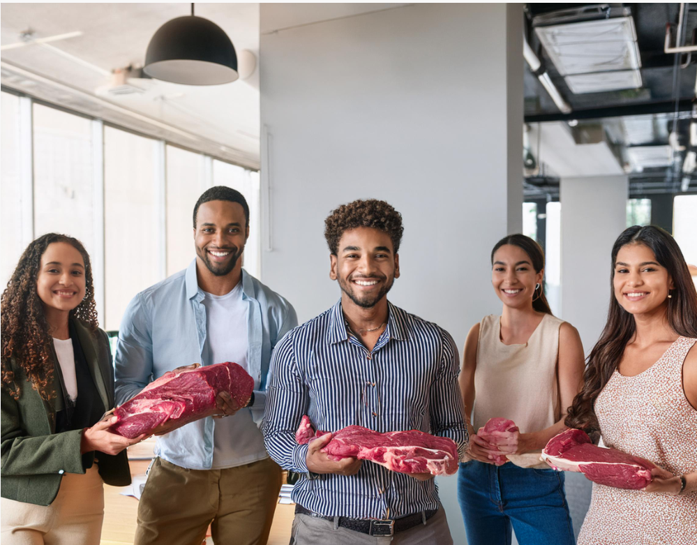 6 junge diverse personen sind in einem innenraum in einem office und schauen nach vorne, fröhlich, eine person hat fleischteile in den händen